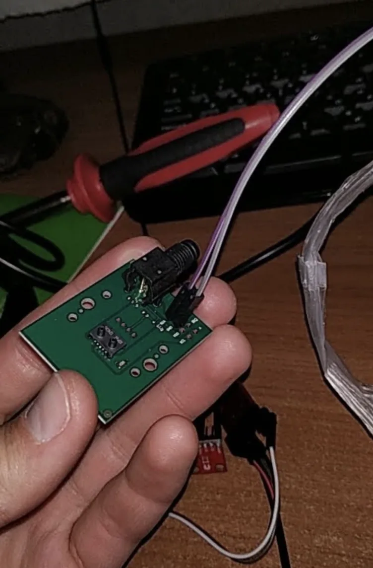 Close-up of the differential pressure sensor board with tubing, wired up for testing